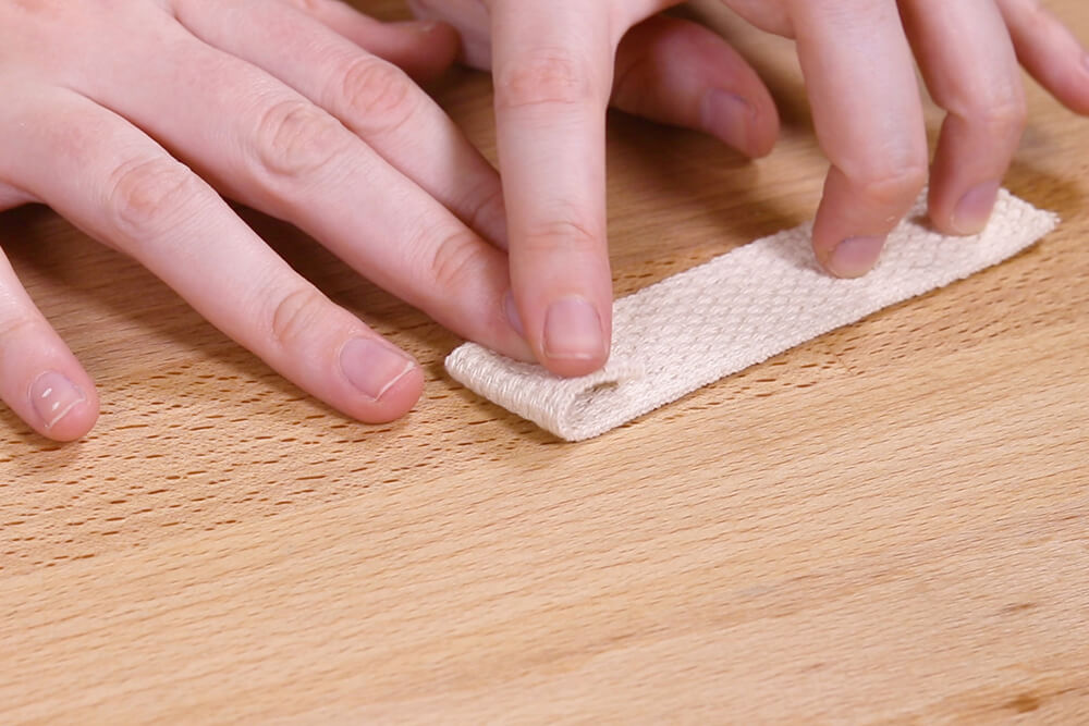 Prepare webbing by folding