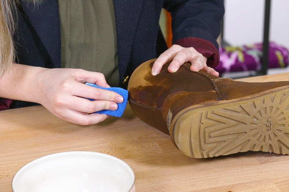 Dab the mixture on the boots
