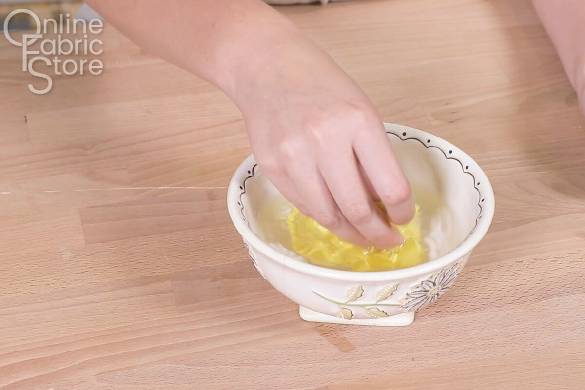 Wash with cold water by hand