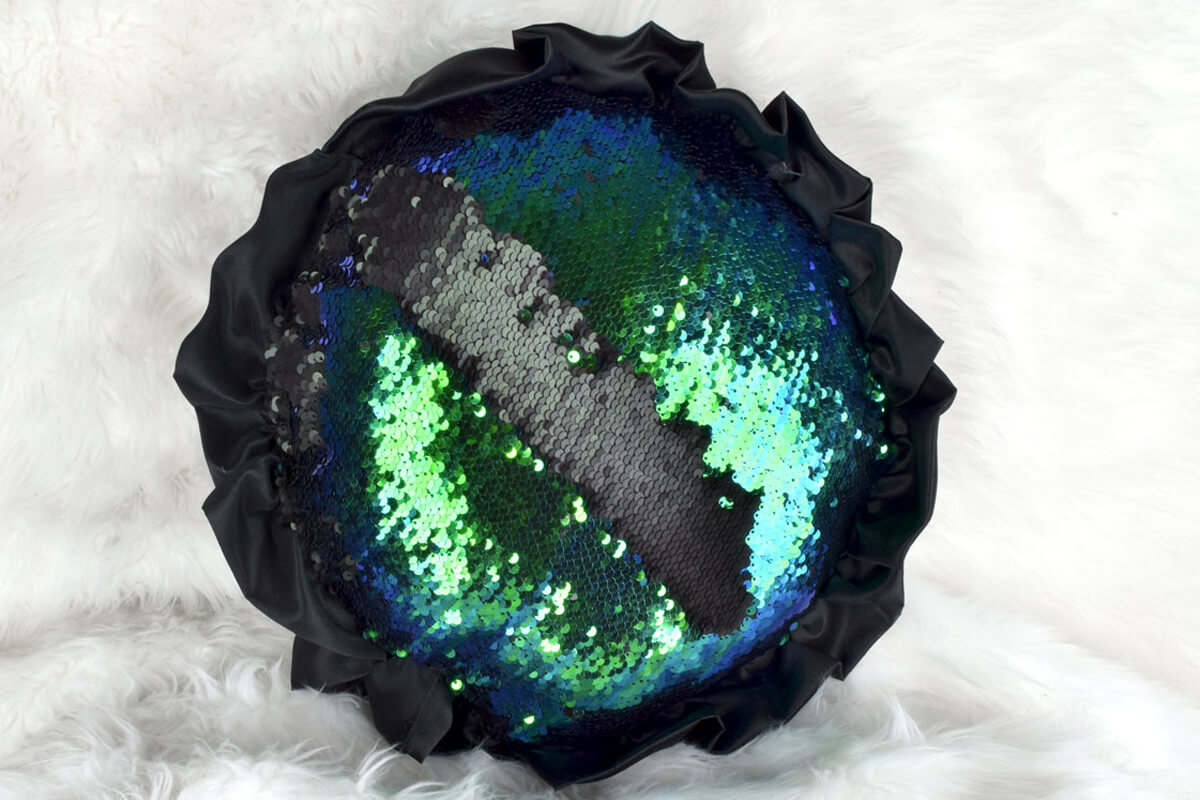 Reversible sequin pillow